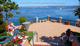 The Monterey Bay Inn is at the beginning of Cannery Row, about .6 miles from the Monterey Bay Aquarium.  A very nice and scenic walk indeed!